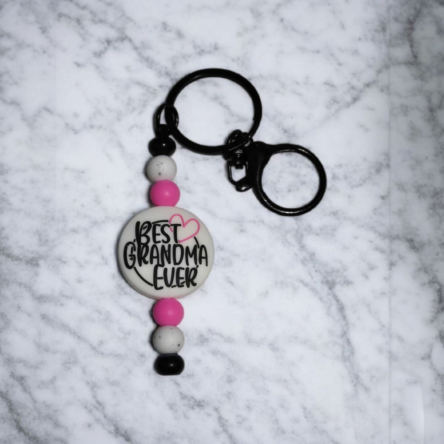 Keychain with 'Best Grandma Ever' text on a marble background
