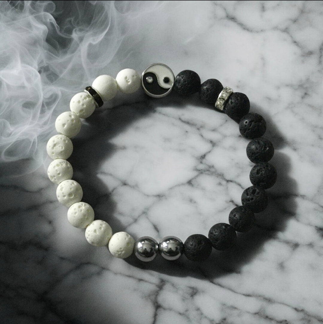 Black and white yin yang lava stone bracelet symbolizing balance and harmony