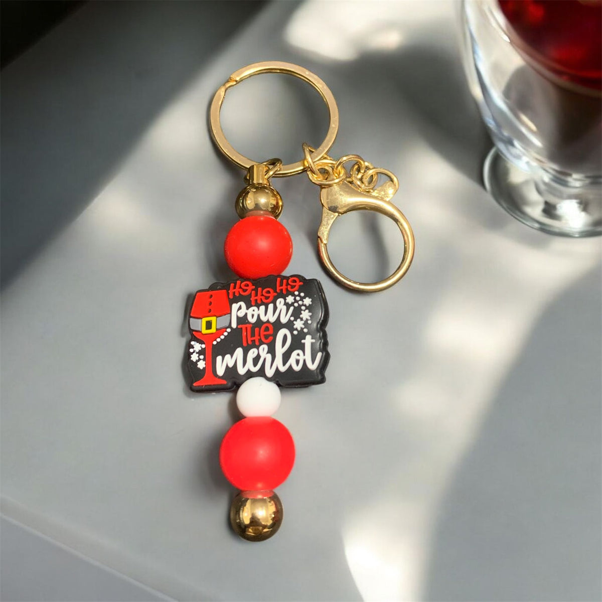 A Christmas inspiredv keychain for a merlot wine enthusiast