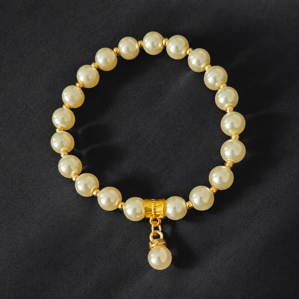 Elegant ivory glass pearl bracelet with gold accents and a pearl charm. A timeless handmade bracelet perfect for weddings, bridesmaids, or everyday elegance.