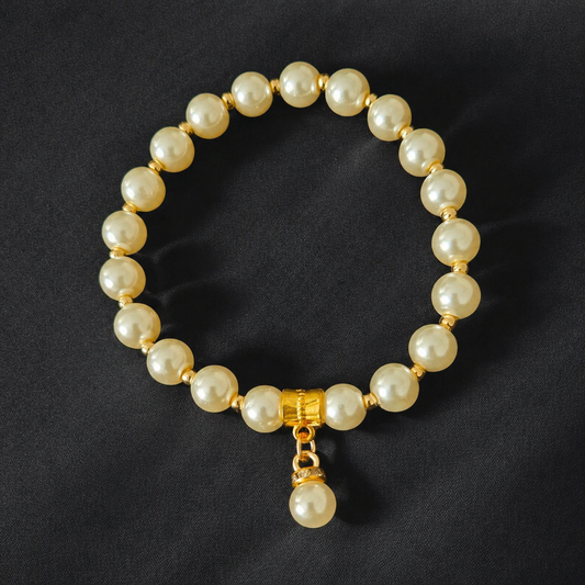 Elegant ivory glass pearl bracelet with gold accents and a pearl charm. A timeless handmade bracelet perfect for weddings, bridesmaids, or everyday elegance.