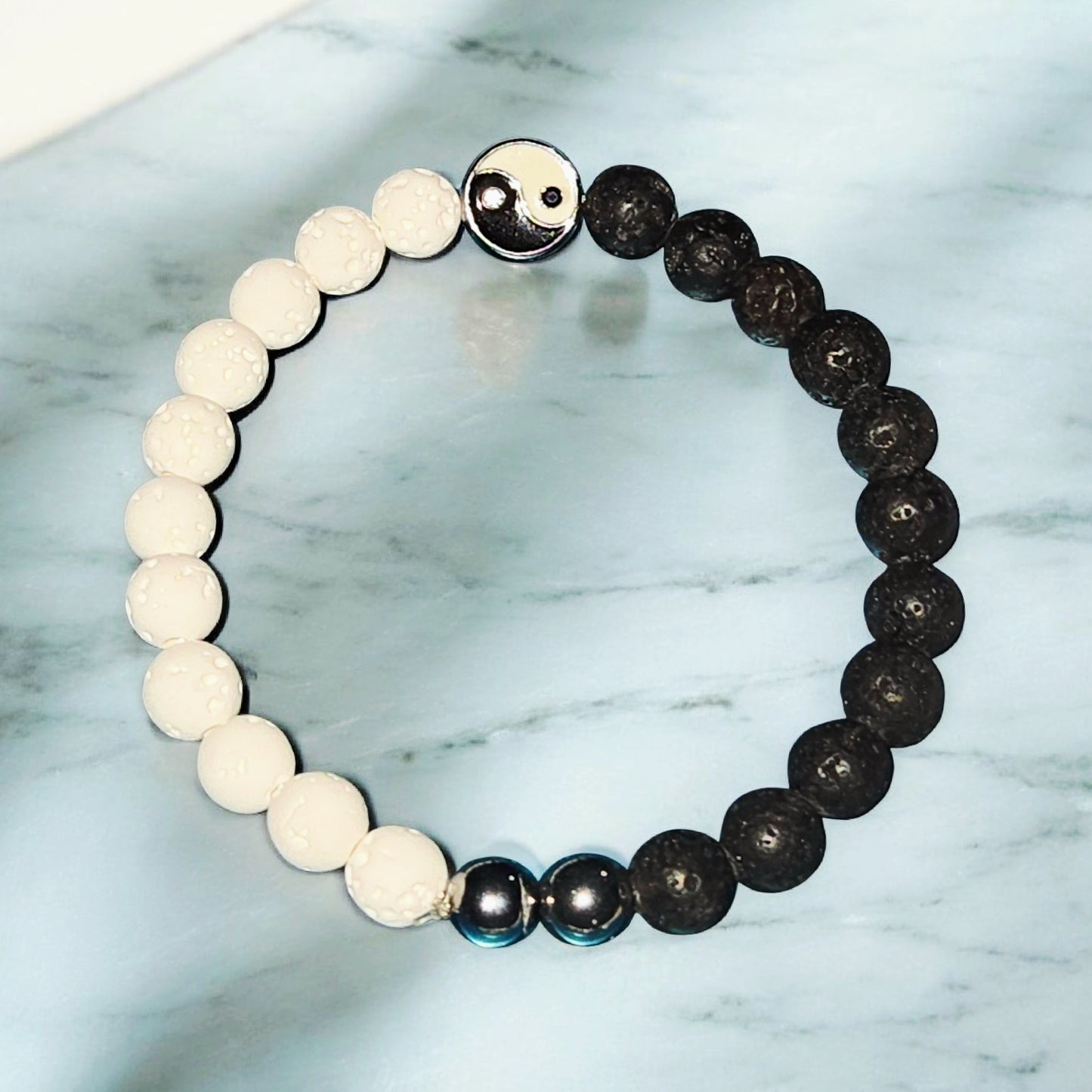 Men's Black and white yin yang lava stone bracelet symbolizing balance and harmony