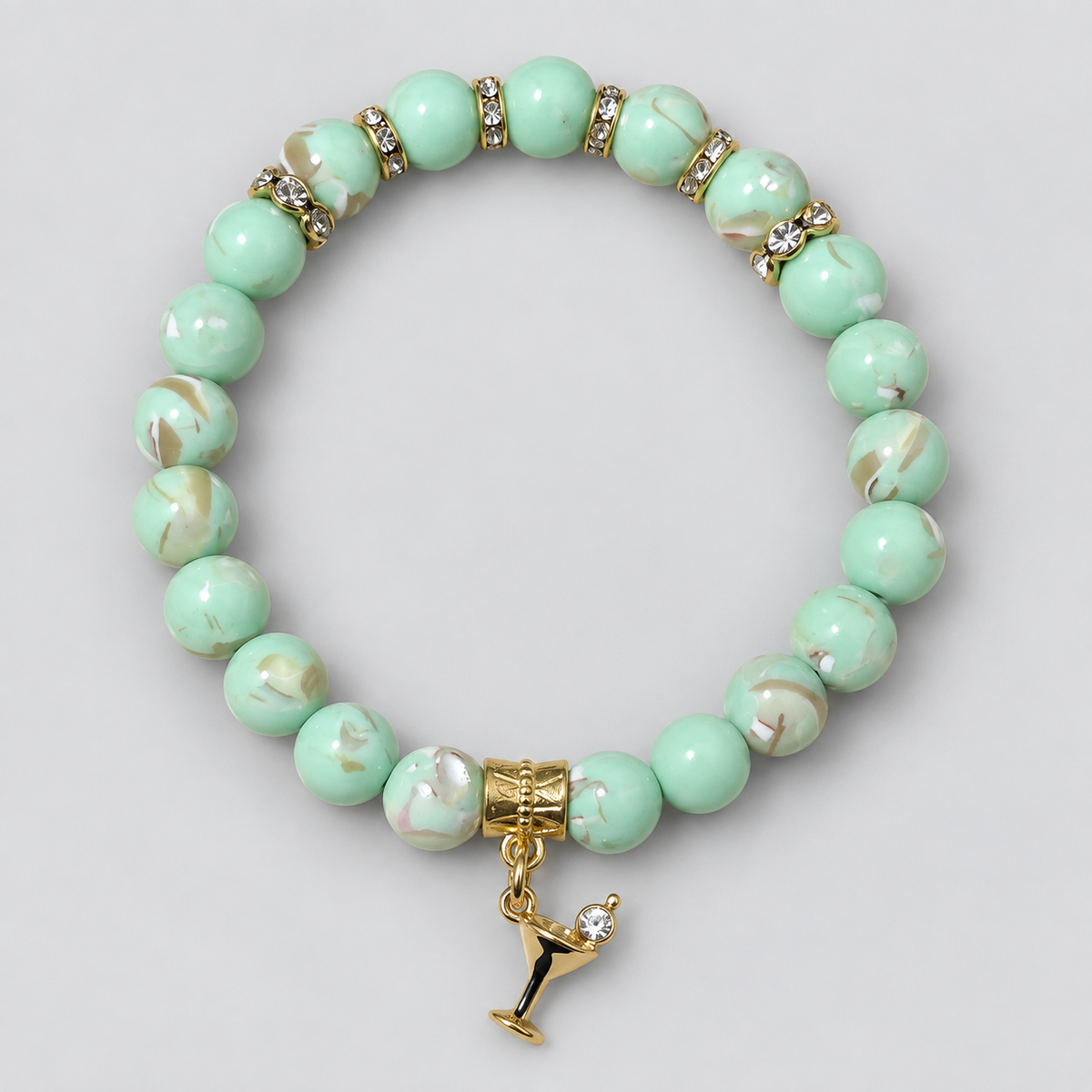 Mint green mother of pearl beaded bracelet with gold rhinestone accents and martini glass charm by Divalicious Designs