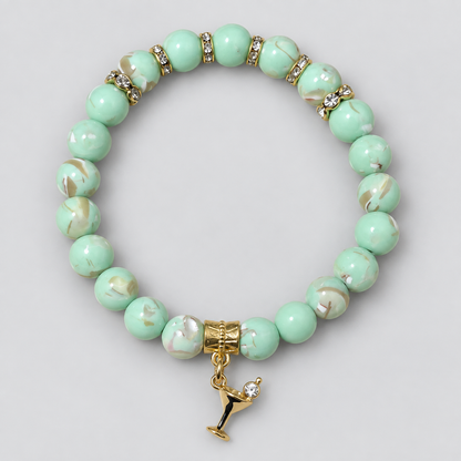 Mint green mother of pearl beaded bracelet with gold rhinestone accents and martini glass charm by Divalicious Designs