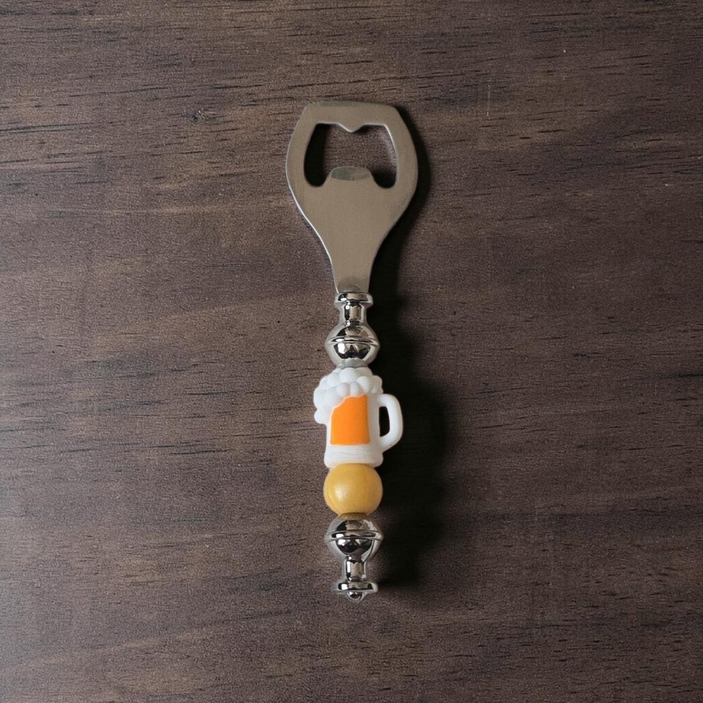 Beer Bottle opener with on a wooden surface silicone beer glass focal bead for beer lovers made by Divalicious Designs in Mississauga 