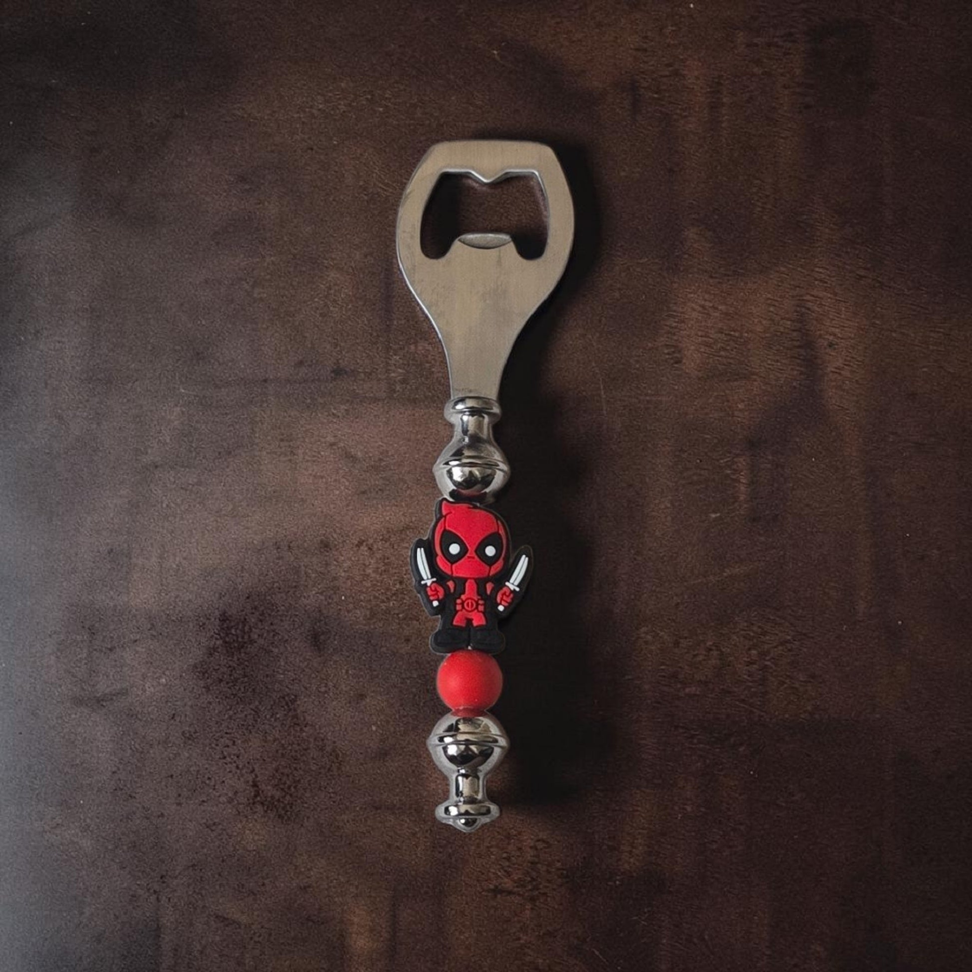 Marvel superhero Deadpool handmade beer bottle opener with metal opener and decorative beads, novelty bar accessory by Divalicious Designs in Mississauga