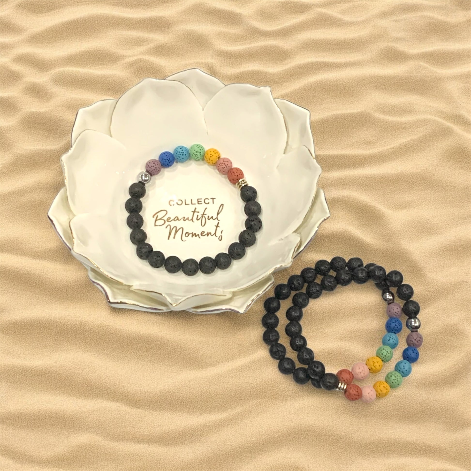 Three reiki lava bed bracelets are pictured with a lotus shaped white bowl with the text, "Collect Beautiful Moments ".
