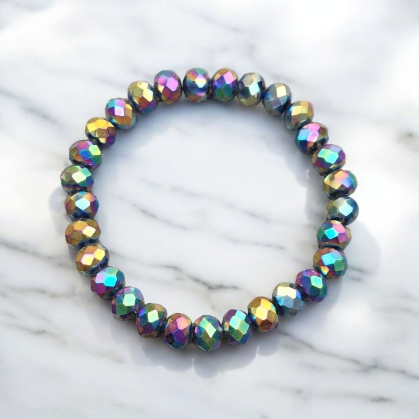 A Multi-chrome Crystal Bracelet on a light marble surface.  Photo and Bracelet made by Divalicious Designs.