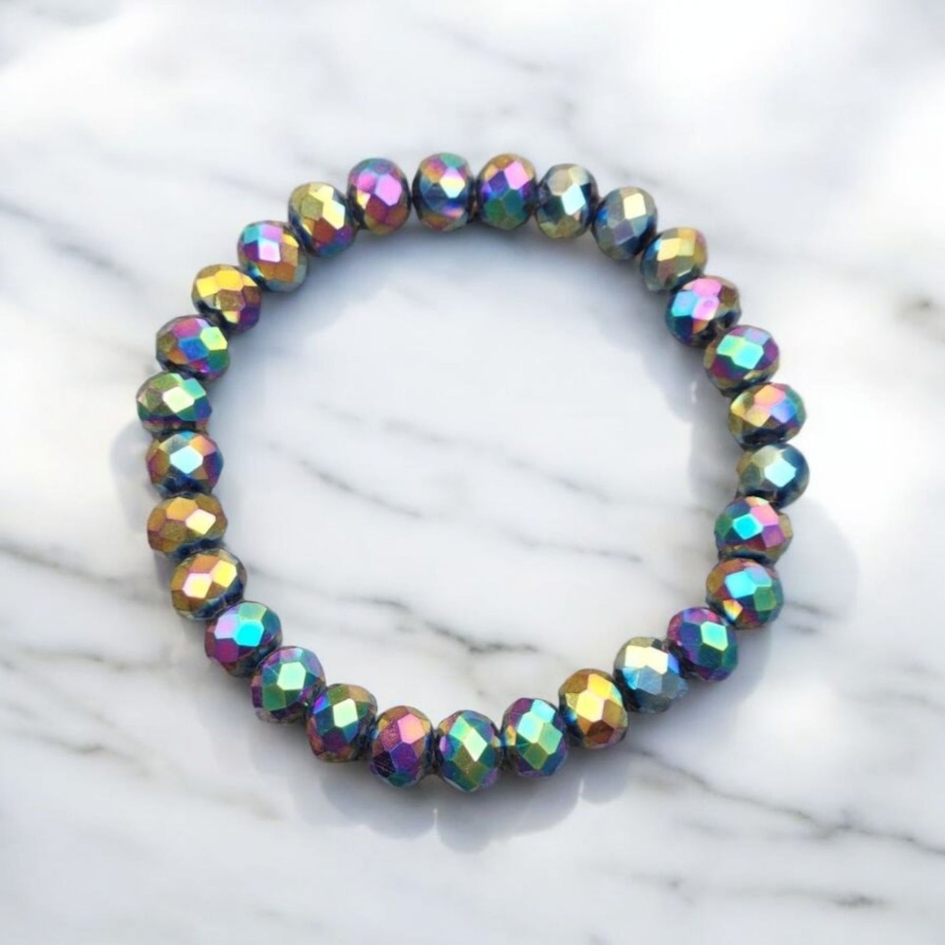 A Multi-chrome Crystal Bracelet on a light marble surface.  Photo and Bracelet made by Divalicious Designs.