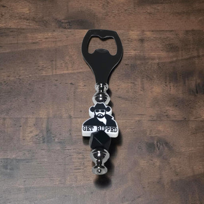 Yellowstone, Dutton Ranch Beer Bottle opener with a character Rip Wheeler and 'GET RIPPED' text on a wooden surface