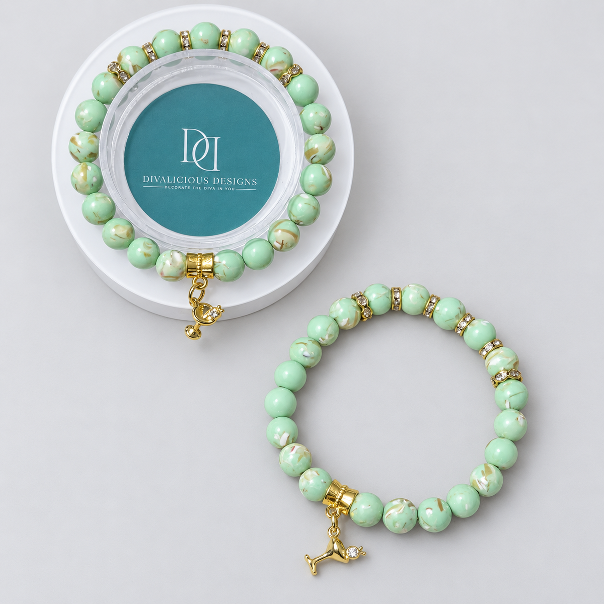 Mint green mother of pearl beaded bracelet with gold rhinestone accents and martini glass charm by Divalicious Designs