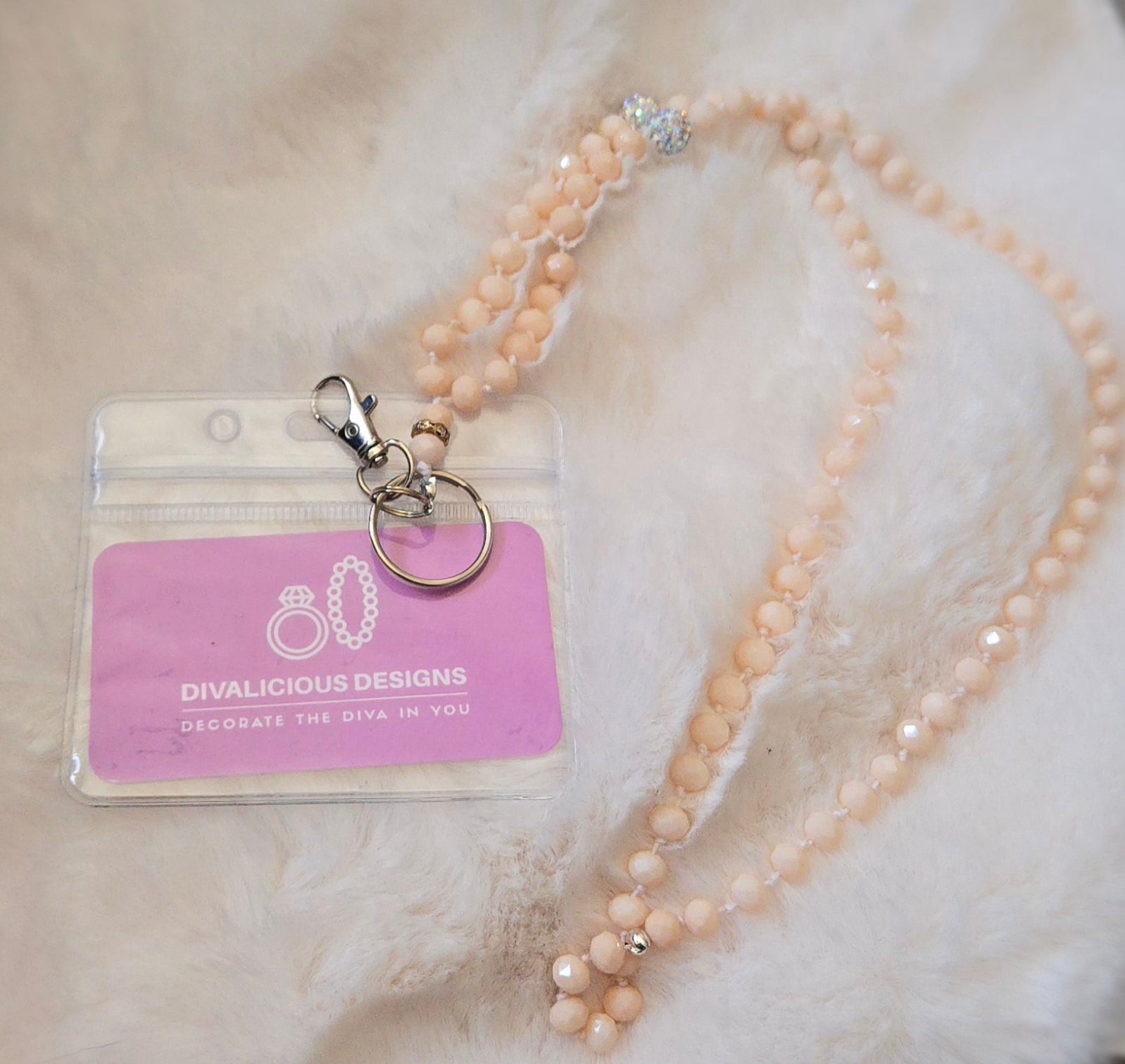 Beaded necklace with a clear ID badge on a soft background